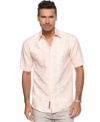 Add some class to your casual. They'll all know how well you clean up in this crisp, embroidered shirt from Cubavera.