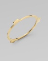 A square-edged, flat bangle with three tab extensions has an edgy, industrial look.BrassDiameter, about 3Imported