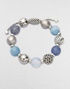 From the Elements Collection. Rich textures and soft shades combine in a stunning strand of 14mm sterling silver, blue chalcedony, aquamarine and moon quartz beads with a silver oval slide clasp.Blue chalcedony, aquamarine and moon quartzSterling silverDiameter, about 2Adjustable slide claspImported