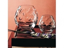 Theis modern and contemporary bowls features thumb shapes cut into the crystal for comfort and sensuality.