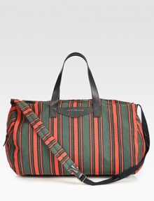 Versatile striped fabric duffle accommodates the essentials, including two tech compartments.Two leather top handlesAdjustable shoulder strap, 21.5-49.5 longTop zip closureTwo outside side zip pocketsInside zip pocketTwo tech compartmentsLined70% cotton/30% polyester20W X 13.5H X 13.5DImported