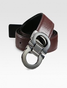 Smooth on one side and textured on the other, this reversible belt crafted in smooth Italian leather with double gancini buckle, will be a versatile addition to your existing wardrobe.LeatherAbout 1½ wideMade in Italy