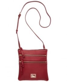 A classic crossbody with a place for everything, this Dooney & Bourke bag will keep you organized for seasons to come. Zipper pockets and a signature emblem grace the front of this gorgeous design.