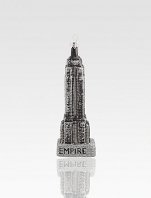 The iconic form of New York's Empire State Building appears to be dusted with sugar in this glittering glass creation to hang on your tree.Handmade and hand-paintedGlassAbout 6.5H X 1.5W X 1.25DImported