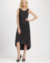 Gorgeous silk jersey tailored with retro-flare in this ultra-feminine silhouette, finished in a perky dotted print.Jewel necklineSleevelessSet-in waistGathered pleats at waistCrossover skirtHem longer in backBack pleats at waistCenter back zipperAbout 32 from natural waist60% silk/40% modalDry cleanImported