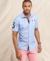 With screen print detailing and a modern. slim fit this shirt from Tommy Hilfiger has got your number.