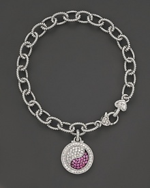 Sparkling sapphires form a brilliant yin yang, set in sterling silver. By Judith Ripka.