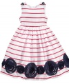 Go-anywhere gorgeous. Stripes and contrasting ribbon pattern give this Marmellata dress unique flair that's special enough for any event.