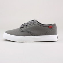 Complete his casual look with these boys' classic low top sneakers. Features a canvas upper, waxed laces, rubber logo ankle tag & rubber/textile sole. Imported.