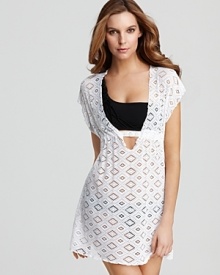 A crochet coverup from Becca® by Rebecca Virtue complements your swimwear with a feminine, body-skimming cut.