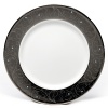 Romance dinner plate by Lauren by Ralph Lauren Home. Inspired by tooled silver buckles, this striking collection offers classic forms with a surprising twist as the graceful lines dance on rich platinum and accents of turquoise are featured.