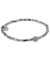 This season's most on-trend accessories are the ones perfect for stacking. Michael Kors' sleek, stretchable style combines silver beading with a pave crystal fireball for ultimate shimmer and shine. Crafted in silver tone mixed metal. Approximate diameter: 2/1/4 inches. Approximate width: 1/8 inch.