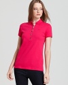 Timeless and seasonless--the makings of a staple. Do basics Brit-style with this classic polo. From Burberry Brit.