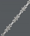 Decorate your wrist with floral elegance. Charter Club bracelet features glittering crystal flowers set in silver tone mixed metal. Approximate length: 7 inches.