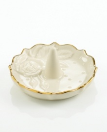 A single rose blossom and delicate dots carved in ivory porcelain make this classic ring holder a fine storage space for special jewelry. With a scalloped, gold-tipped rim. Qualifies for Rebate