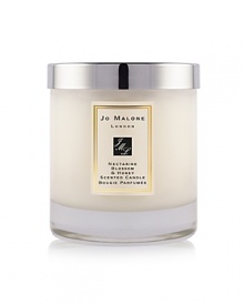 A youthful and fruity fragrance, inspired by the delicious scent of just-ripening nectarines and a taste of refreshing peach sorbet. Mouthwatering nectarine and peach with hints of plum, blackcurrant and vetiver are combined with the sweet warmth of acacia honey in this truly seductive combination. The Nectarine Blossom & Honey Home Candle infuses any room with evocative scent and lasts for hours. An everyday luxury, it brings warmth to any environment. 200g.