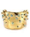 Mod meets modern with this turquoise and gold cuff from Alexis Bittar, boasting vintage-inspired lines and retro hues.