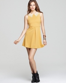 This Free People dress exudes girlish charm with a dainty crochet collar and sweet silhouette.