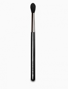 Burberry Eye Brush No. 09 is a long-bristled blending brush with a slight point. Made from ultrasoft goat hair, it is used to apply eyeshadow at the tip to create a deeper, but soft, socket line. Used by Burberry Beauty makeup artists to create an effortless smoky eye look. 