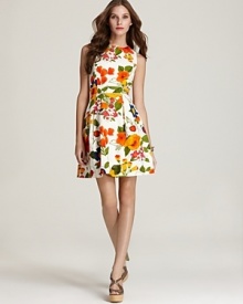 This spring-prefect Trina Turk dress boasts a cheerful print and charming silhouette.