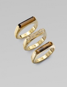 Three exquisite rings with either rich, tiger's eye bars or dazzling rhinestones, perfect for stacking. Tiger's eyeGlass stonesGoldtone brassWidth, about ¾Imported