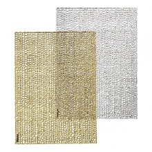 Metallic foil printing creates a shimmering finish on these festive placemats, a glamourous accent for any table.