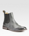 A classic chelsea boot is a sartorial standard, crafted here in burnished leather for a well-worn finish and with side elastic gores for a superior fit.Leather upperLeather liningPadded insoleLeather soleImportedThis style runs true to size. We recommend ordering your usual size for a standard fit. 