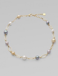 A gorgeous blend of different colored pearls with 18k goldplated sterling silver links. 10mm and 12mm round white, champagne, grey and black organic hand-made pearls 18k goldplated sterling silver Lobster clasp closure Length, about 16 to 18 adjustable Imported 