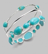 From the Scultura Collection. Shapes of brilliant turquoise cabochon, richly framed in sterling silver, vibrantly decorate the wrist.Turquoise cabochon Sterling silver Diameter, about 2½ Imported