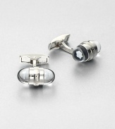 Signature cuff links, finished in platinum highlighted by a floating embossed emblem stars.PlatinumAbout 1 diam.Imported