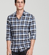 Brightly blue and black, this BOSS Orange plaid shirt updates the classic style with a slim fit for year-round style.