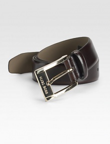 A smooth and sophisticated belt designed in fine calfskin leather with a shiny gold buckle. About 1 wide Imported 