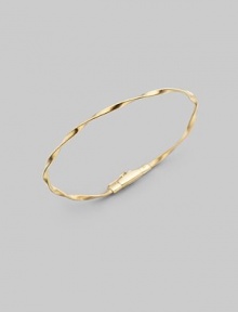 Simply stunning, this 18k gold bangle with delicate ridges and twists is great on its own, even better when stacked in multiples. 18k goldDiameter, about 2½Tongue-and-groove claspImported Please note: Bracelets sold separately. 