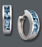 Cool off in blue hues. Baguette-cut blue topaz (2-1/2 ct. t.w.) adds chic, calming color to a traditional pair of hoops. Crafted in sterling silver. Approximate diameter: 1/2 inch.