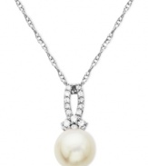 Stunning and sophisticated. This pendant features a cultured freshwater pearl and diamond accents for a stunning effect. Crafted from 10k white gold. Approximate length: 18 inches. Approximate drop length: 5/8 inch. Approximate drop width: 1/4 inch.