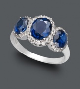 A sumptuous three stone design in brilliant blue hues. Effy Collection's standout ring highlights oval-cut sapphires (2-7/8 ct. t.w.) encircled by round-cut diamonds (1/3 ct. t.w.) set in 14k white gold.