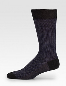 Socks with a classic herringbone pattern and solid ends.80% wool/20% nylonMachine washMade in Italy of imported fabric