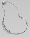 From the Iris Collection. Carved frosted rock crystal beads punctuate this sterling silver chain link style. Sterling silver Toggle closure Length, about 18 Imported 