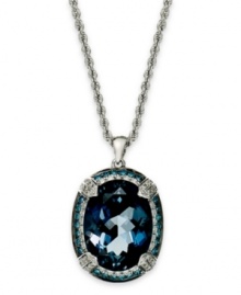 A piece of the ocean. This stunning pendant features an oval-cut London blue topaz (10-3/4 ct. t.w.) surrounded by halos of round-cut black diamonds (1/3 ct. t.w.) and white diamonds (1/3 ct. t. t.w.). Set in 14k white gold. Approximate length: 18 inches. Approximate drop: 1 inch.