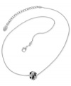 Fashion in flames. This GUESS necklace features a single fireball charm emblazoned with glistening accents and bold jet epoxy. Crafted in silver tone mixed metal. Approximate length: 16 inches + 2-inch extender. Approximate drop: 1/4 inch.