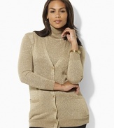 A classic v neck cardigan is elegantly updated for the season in glimmering metallic jersey with polished gold-tone metal buttons for glamorous appeal.