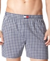 A four-pack wardrobe of cotton boxer shorts-in a palette true to the red, white, and blue-from Tommy Hilfiger.