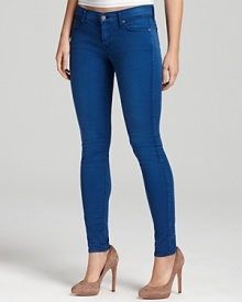 Subtle fading creates a cool sun-bleached effect on these vibrantly hued 7 For All Mankind skinny jeans.