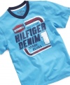 Changing style can be as easy as changing the oil when he throws on this vintage-style v-neck t-shirt from Tommy Hilfiger.