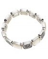 This versatile Monet stretch bracelet will dress up a casual outfit or accentuate a professional look perfectly. In silvertone mixed metal with mother-of-pearl. Stretches to fit wrist. Approximate diameter: 3-1/2 inches.