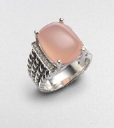 From the Wheaton Collection. A faceted cushion of milky pink opal, edged by rows of diamonds, in a wide cable band of sterling silver.Diamonds, 0.16 tcw Pink opal Sterling silver Width, about ½ Imported