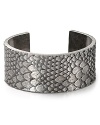 Inspired by reptilian scales, this MARC BY MARC JACOBS cuff flaunts bold texture. Slip on this sinuous showpiece for exotic glamor.