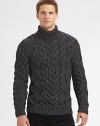 A chunky, cable-knit turtleneck, shaped in a fine wool blend, offers superior warmth and comfort on those brisk, winter days.Ribbed knit cuffs and hem56% wool/44% polyesterDry cleanImported