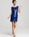 Cool cobalt sequins capture the light for a spectacular impact from this Alice + Olivia dress. Boasting a deep scoop back with a tie at the shoulders, this revealing style is the dose of drama your evening requires.