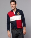 Best blocking. Cool will be just your style in this contrasting, color-blocked Tommy Hilfiger polo shirt.